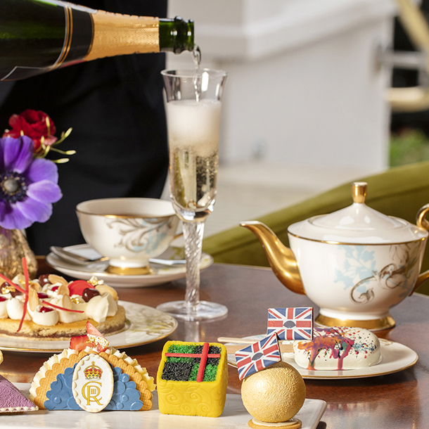 Mandarin Hotel Hyde Park’s royal afternoon tea with champagne, tea and coronation-themed pasteries being served.